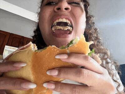 Enjoying a Milanese sandwich with chocolate cones, chewing and savoring